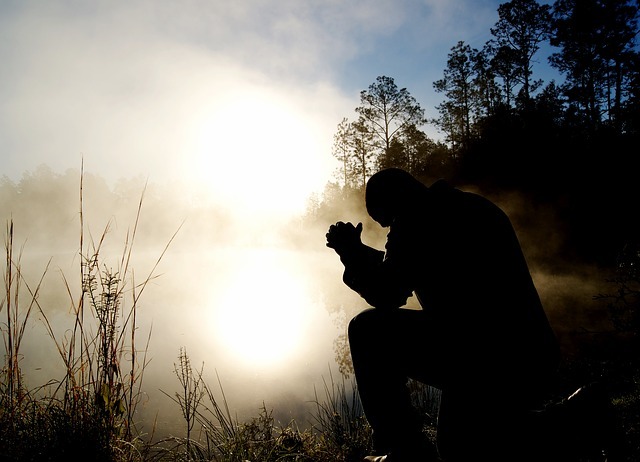 MAN PRAYING