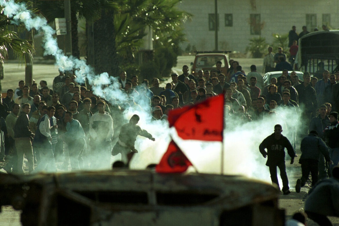 Palestinians shoot tear gas at the Israeli army in Ramallah